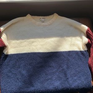 Large sweater. Colors- white, blue, and red